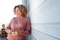 Happy woman enjoying music with earphones and mobile phone Royalty Free Stock Photo