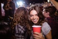 Portrait of happy woman enjoying music festival Royalty Free Stock Photo