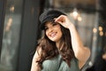 Portrait of happy woman in french style hat