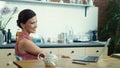 Woman having video call online in kitchen. Female saying hello on webcam. Royalty Free Stock Photo