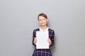 Portrait of happy woman holding white blank paper sheet in hands Royalty Free Stock Photo