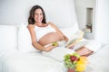 Portrait of happy woman with novel and Granny Smith Royalty Free Stock Photo