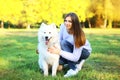 Portrait happy woman owner and dog in the park Royalty Free Stock Photo