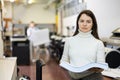 Portrait of happy woman with a stack of paper in her hands in typography