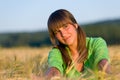 Portrait of happy woman in sunset corn field Royalty Free Stock Photo