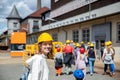 Portrait happy woman tourist wear yellow safety helmet equipment at Rammelsberg Unesco Mine trip entrance group tour Royalty Free Stock Photo