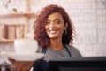 Portrait of happy woman, waitress and cup of coffee in cafe, restaurant and food service industry. Face, barista, and Royalty Free Stock Photo