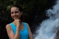 Portrait of happy woman at waterfall. Smiling Caucasian woman. Girl touching the chin with her hand. Travel lifestyle. Jembong Royalty Free Stock Photo