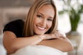 Portrait, happy woman and wellness on sofa in living room, calm and peace on vacation in home. Face, smile and blonde Royalty Free Stock Photo