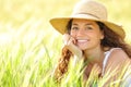 Happy woman with white smile in a field looking at camera Royalty Free Stock Photo