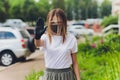 Portrait happy woman wile wearing a face shield for protection from cold and flu and viruses. Young woman with face mask