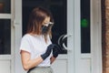 Portrait happy woman wile wearing a face shield for protection from cold and flu and viruses. Young woman with face mask