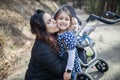 Happy woman with her adorable young daughters in the forest Royalty Free Stock Photo