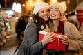 Portrait of happy women exchanging christmas presents. Holiday people christmas happiness concept Royalty Free Stock Photo