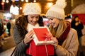 Portrait of happy women exchanging christmas presents. Holiday people christmas happiness concept Royalty Free Stock Photo