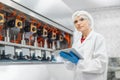 portrait happy women worker working in water plant factory clean hygiene process in bottling drinking water machine line Royalty Free Stock Photo