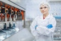 portrait happy women worker working in water plant factory clean hygiene process in bottling drinking water machine line Royalty Free Stock Photo