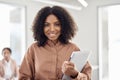 Portrait of happy young African American business woman or student with laptop. Royalty Free Stock Photo