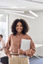 Portrait of happy young African American business woman or student with laptop. Royalty Free Stock Photo