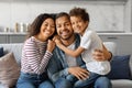 Portrait Of Happy Young African American Family Of Three With Little Son Royalty Free Stock Photo