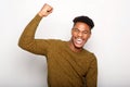 Happy young african american man with arm raised Royalty Free Stock Photo