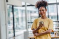 Portrait of happy young African american woman smiling confident using smartphone. afro american businesswoman reading a Royalty Free Stock Photo