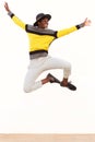 Happy young african man jumping in air over white background Royalty Free Stock Photo