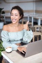 Portrait of a happy young african woman relaxing in outdoor cafe Royalty Free Stock Photo