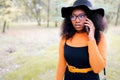 Portrait of happy young african woman talking on mobile phone outdoors Royalty Free Stock Photo