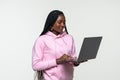 Portrait of happy young afro american woman using laptop computer isolated over white background Royalty Free Stock Photo