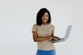 Portrait of happy young afro american woman using laptop computer isolated over white background Royalty Free Stock Photo