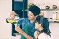 YOUNG COUPLE IN KITCHEN Royalty Free Stock Photo