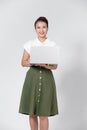 Portrait of happy young asian girl using laptop computer isolated over white background Royalty Free Stock Photo