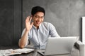 Happy young asian man using laptop Royalty Free Stock Photo