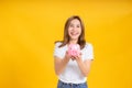 Portrait happy young asian woman holding piggybank saving money for future and business earning income Royalty Free Stock Photo