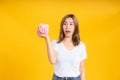 Portrait happy young asian woman holding piggybank saving money for future and business earning income Royalty Free Stock Photo