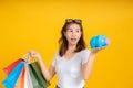 Portrait happy young asian woman holding piggybank saving money for shopping positive emotion Royalty Free Stock Photo