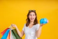 Portrait happy young asian woman holding piggybank saving money for shopping positive emotion Royalty Free Stock Photo