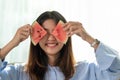 Portrait happy young Asian woman is holding slice of watermelon Royalty Free Stock Photo