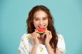 Portrait happy young Asian woman is holding slice of watermelon, funny and happiness concept Royalty Free Stock Photo