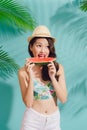 Portrait happy young asian woman is holding slice of watermelon Royalty Free Stock Photo