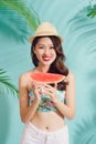 Portrait happy young asian woman is holding slice of watermelon Royalty Free Stock Photo