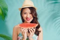 Portrait happy young asian woman is holding slice of watermelon Royalty Free Stock Photo