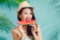 Portrait happy young asian woman is holding slice of watermelon Royalty Free Stock Photo