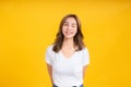 Portrait happy young asian woman laughing blink, wink eye joyful funny positive emotion in white t-shirt Royalty Free Stock Photo