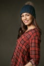 Young, attractive, smiling woman in a red plaid shirt Royalty Free Stock Photo