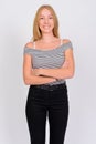 Portrait of happy young beautiful blonde teenage girl smiling with arms crossed Royalty Free Stock Photo