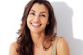 Portrait of happy young beautiful smiling woman. Studio shot of pretty caucasian brunette female on a white background Royalty Free Stock Photo