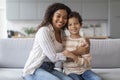 Portrait Of Happy Young Black Mother And Preteen Son Embracing At Home Royalty Free Stock Photo