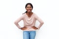 Happy young black woman laughing with hands on hips against isolated white background Royalty Free Stock Photo